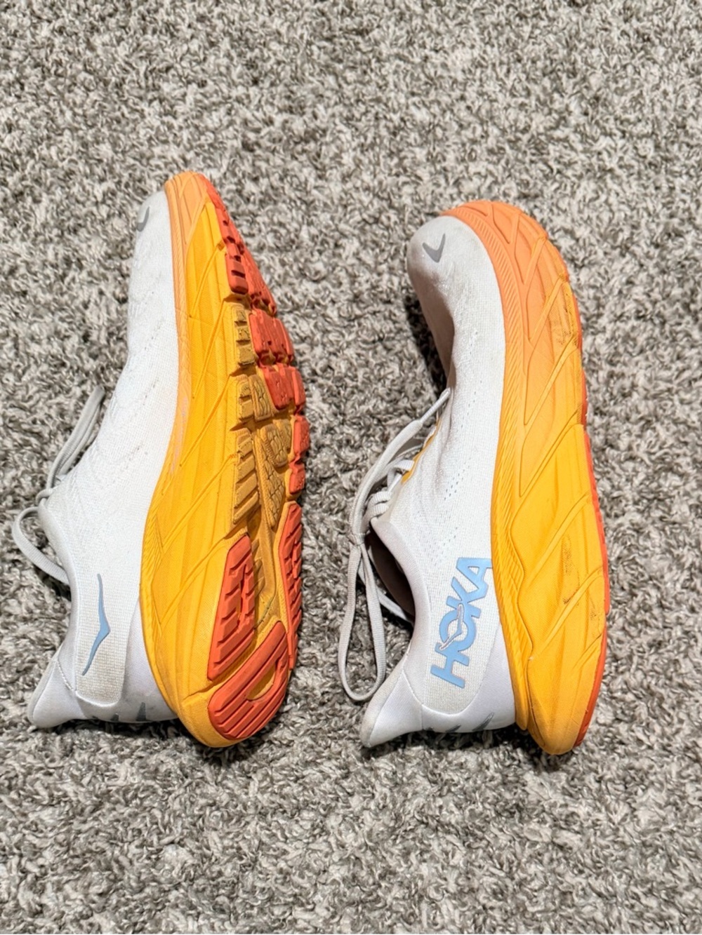 Hoka White Running Shoes with Orange and Yellow Gradient Soles